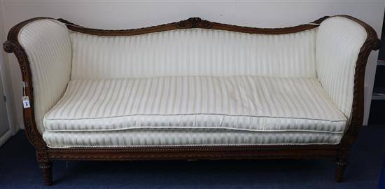 A Louis XVI style walnut serpentine settee, W.7ft 2in. D.2ft 10in. H.3ft 2in.